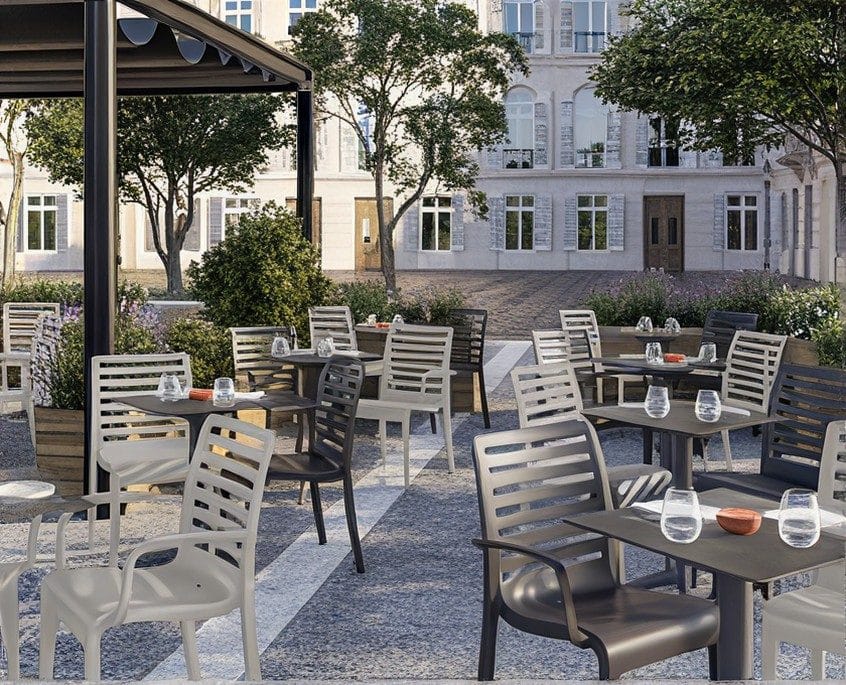 Grosfillex outdoor dining chairs and tables on a terrace