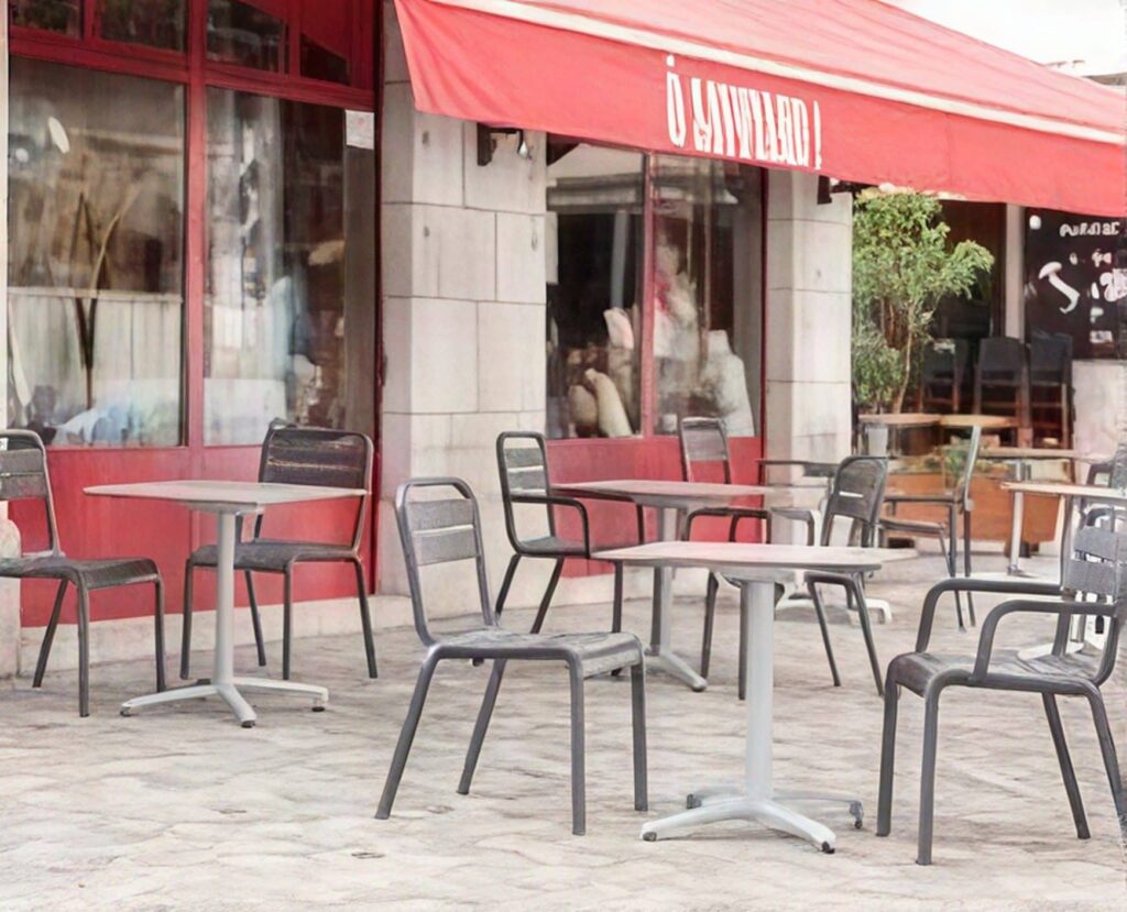 Grosfillex tables and stacking chairs outside a cafe