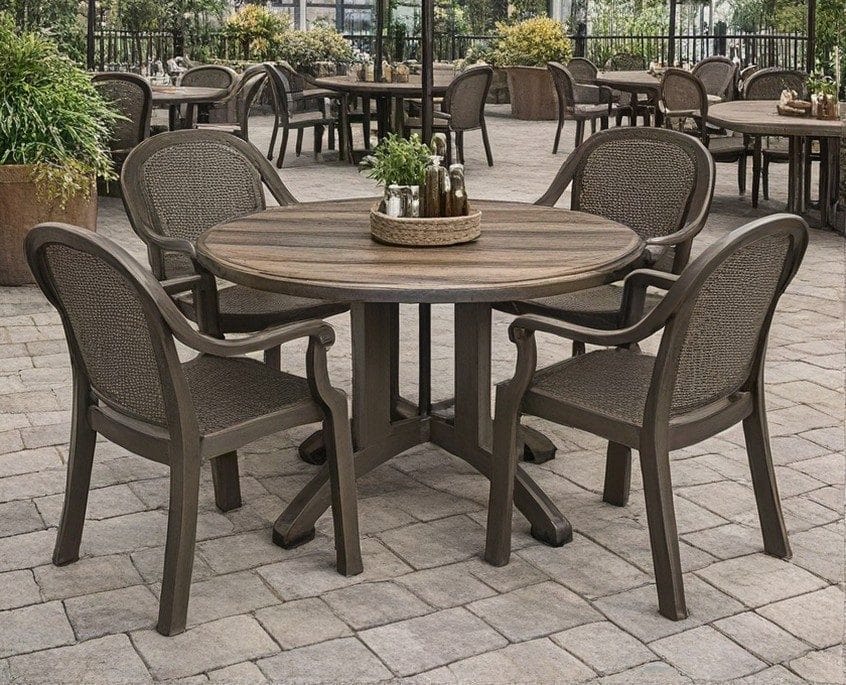 Grosfillex round dining table and wicker armchairs